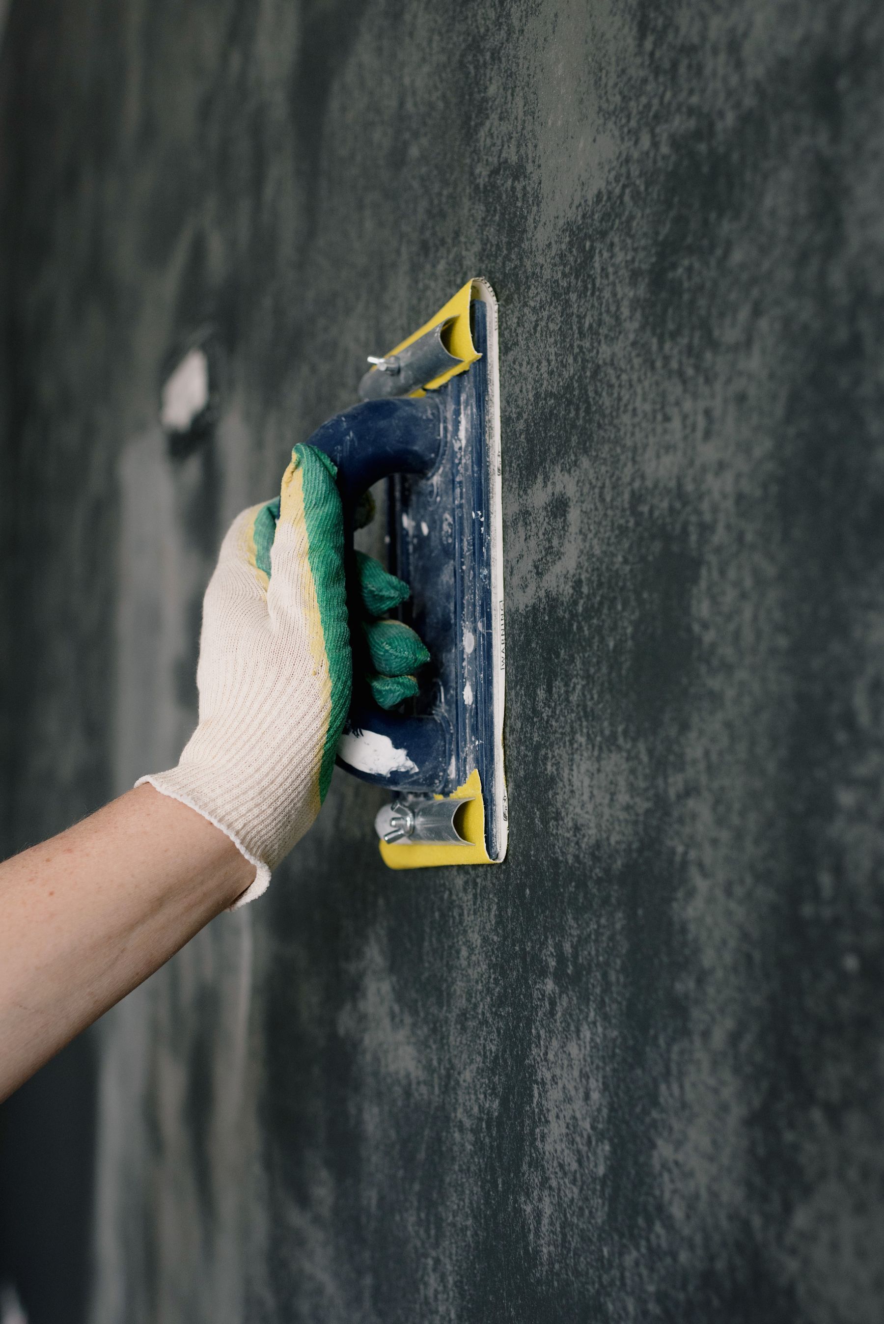 Sanding a freshly patched drywall repair